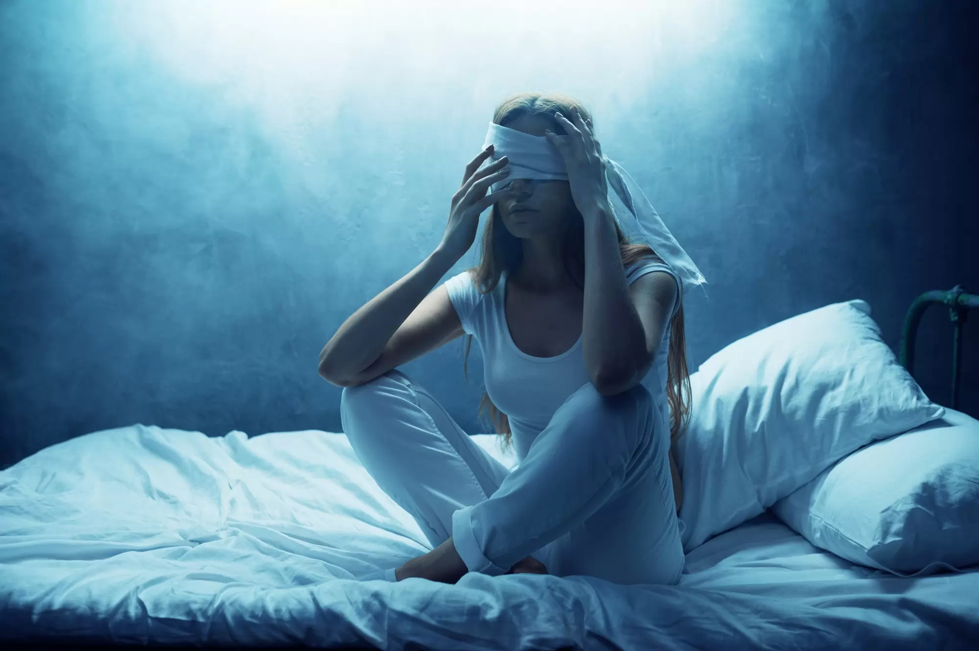 Blindfolded psycho woman in bed, psychedelic