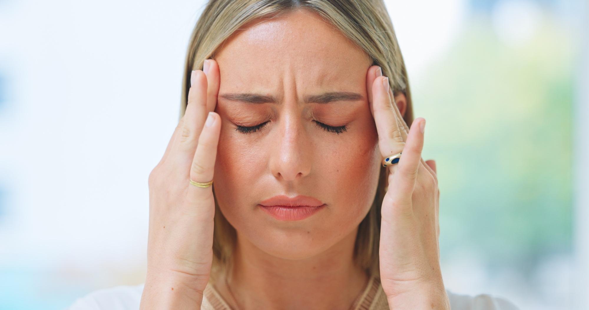 Business, woman and headache in office with stress, burnout and risk in corporate company from migr