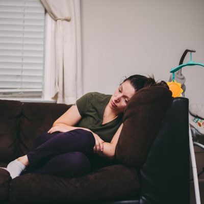 A mother who is feeling lonely, tired and sad. Postpartum depression, anxiety, motherhood