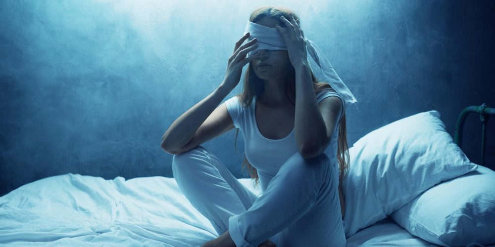 Blindfolded psycho woman in bed, psychedelic