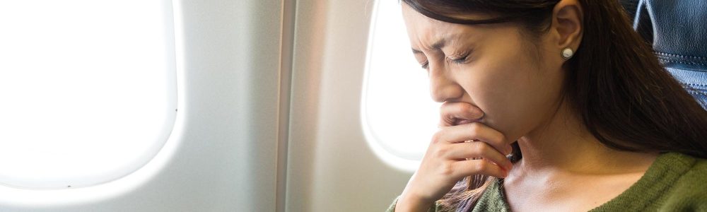 Fear of flying woman in plane airsick