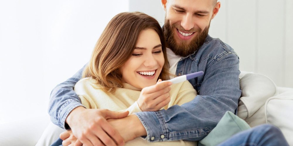 I'm Pregnant! Happy Couple Checking Pregnancy Test