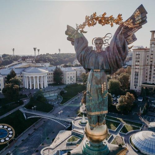 Kyiv, Ukraine - September, 2021: Maidan Nezalezhnosti square - aerial drone view. Monument of Independence - Berehynia in the center. Golden beautiful Ukrainian woman statue. High quality 4k footage